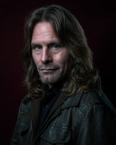 portrait of a man with long hair