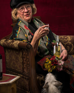 woman with wine glass and dog