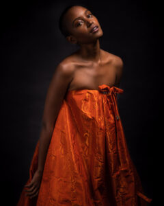 model in orange dress