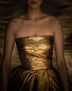 model with gold dress