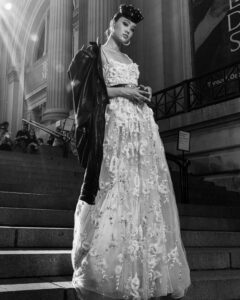 woman dressed in bridal gown walking down steps