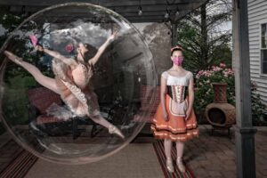 ballerinas practicing in their backyard one is in a bubble