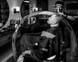 man in bubble at barber shop